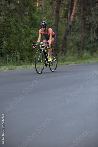 Athletic girl rides a bike © Andriy Bezuglov