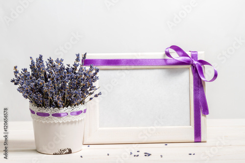 Bunch of lavender on a background of the empty form for congratulations on a wooden frame (Provence)