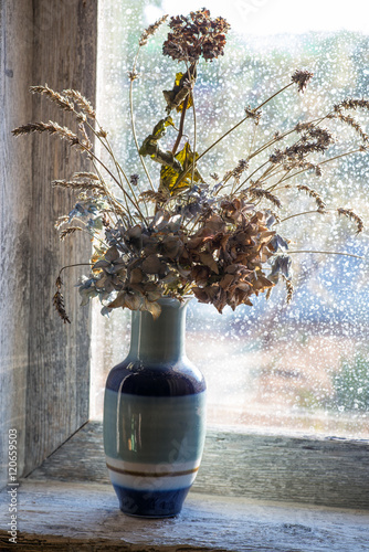 vase with dried flowers photo