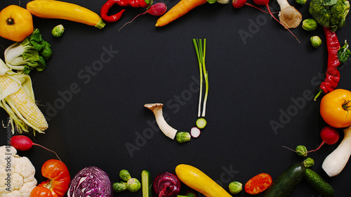 Wallpaper Mural Vegetables made letter J. Tomatoes, cabbage, peppers and other vegetables on a black background. Cabbage, radishes and mushrooms on a table of black wood. J Torontodigital.ca