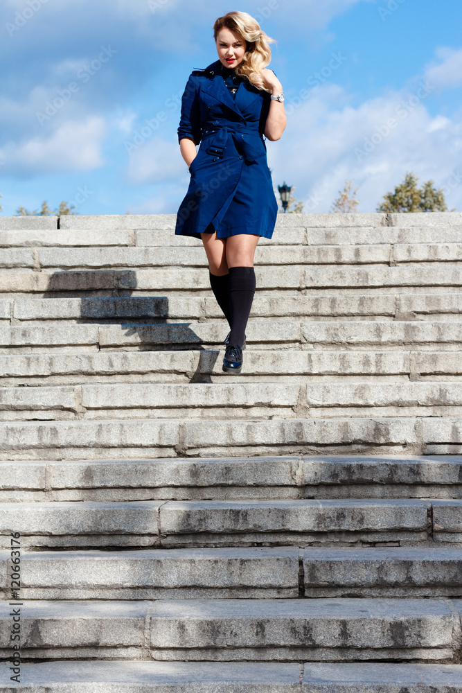 Girl in In Blue Coat On Stairs