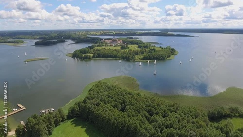 View of small islands on the lake in Masuria and Podlasie district, Poland. Blue water and whites clouds. Summer time. View from above. photo