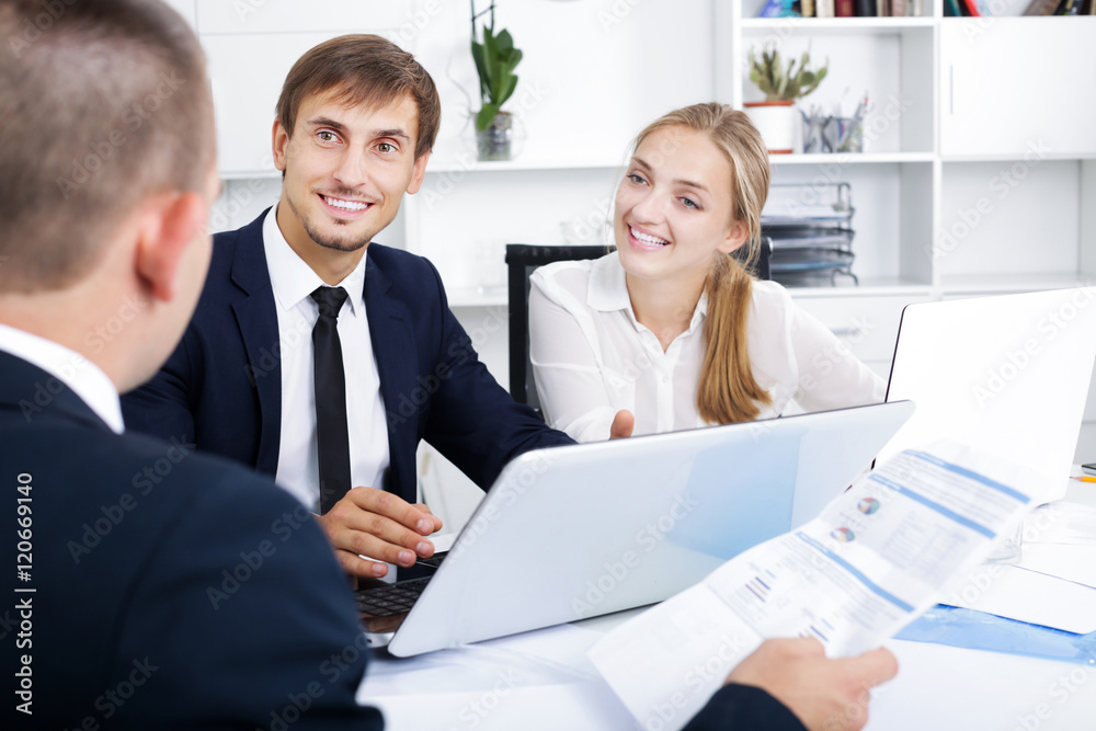 Fototapeta premium Coworkers chatting about business project