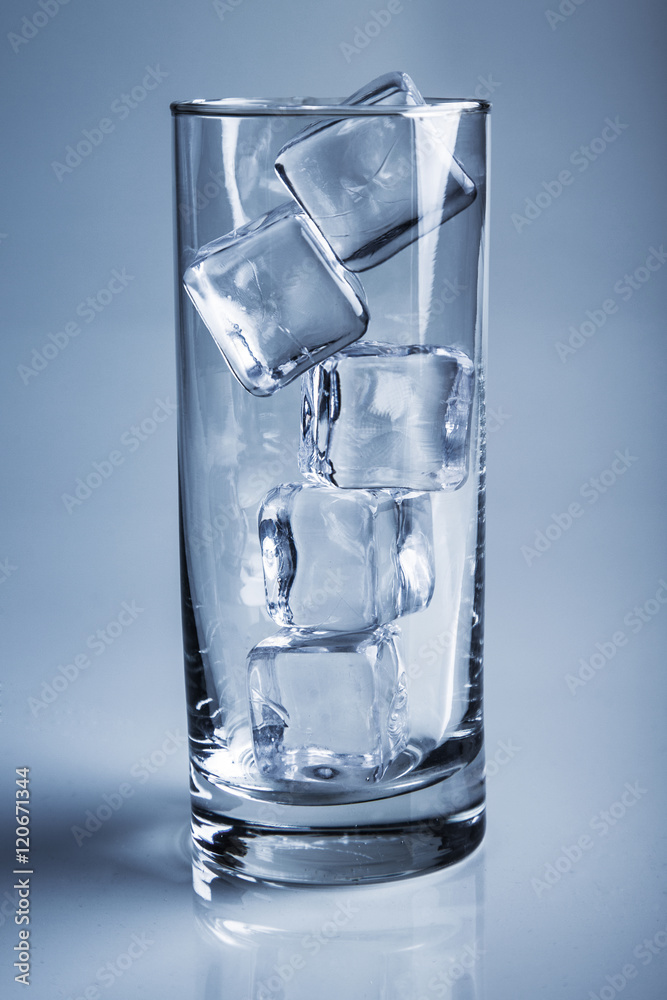 photo of empty glass with ice cubes on studio shot photo of empty glass with ice cubes on studio shot