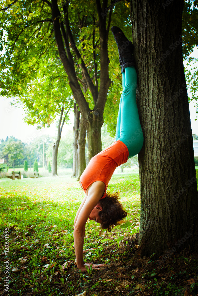 Fototapeta premium young woman practice balance outdoor