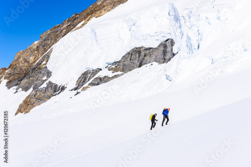 Ice Climbing on glacier in the mountains of Switzerland - Aletsch Glacier