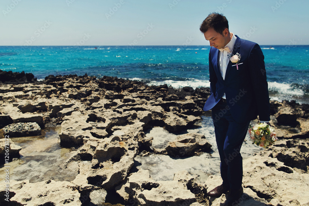 Elegant stylish smiling young groom Elegant stylish smiling young groom