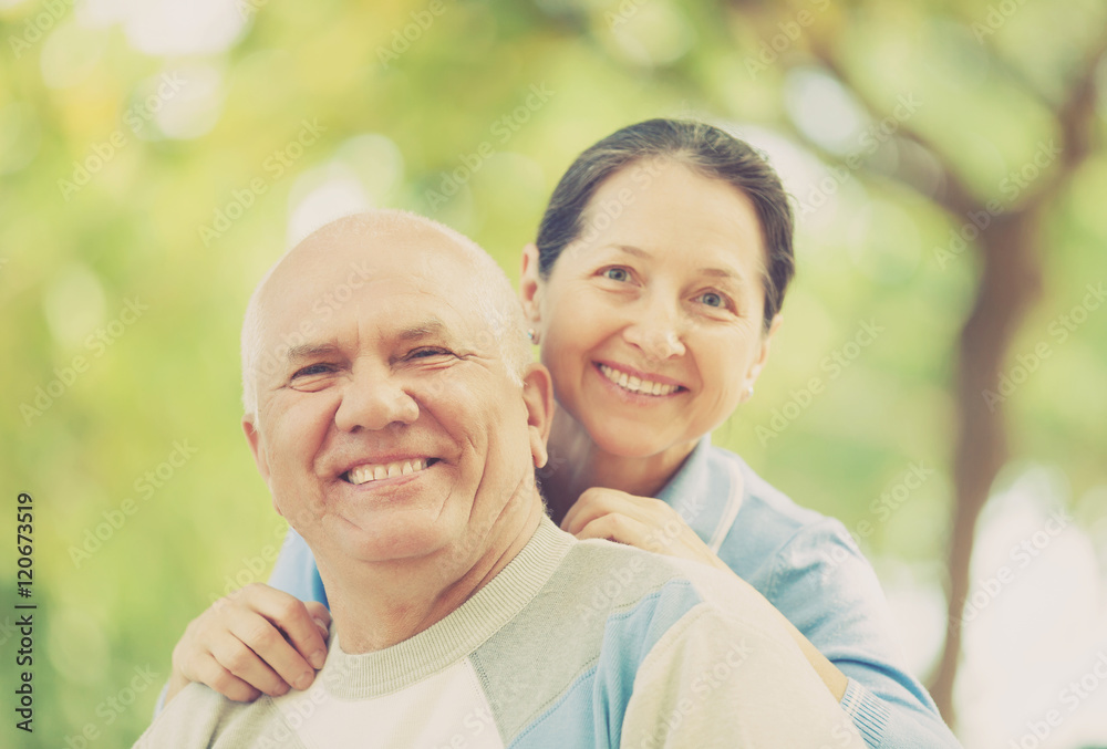 Fototapeta premium Happy mature couple together in autumn park