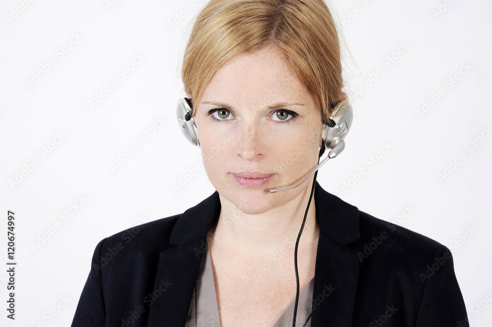 Portrait of a nice freckled face woman in a call center with phone headset. Studio shot isolated on light background Portrait of a nice freckled face woman in a call center with phone headset. Studio shot isolated on light background