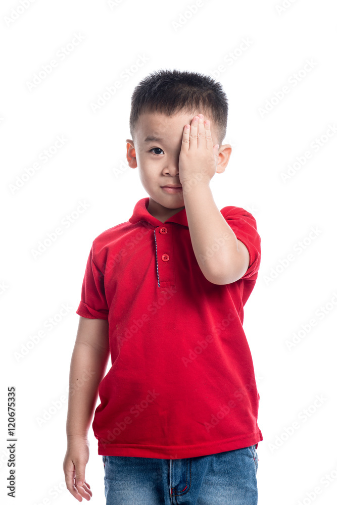 Portrait of cute smiling little boy closed one eye with his hand Portrait of cute smiling little boy closed one eye with his hand