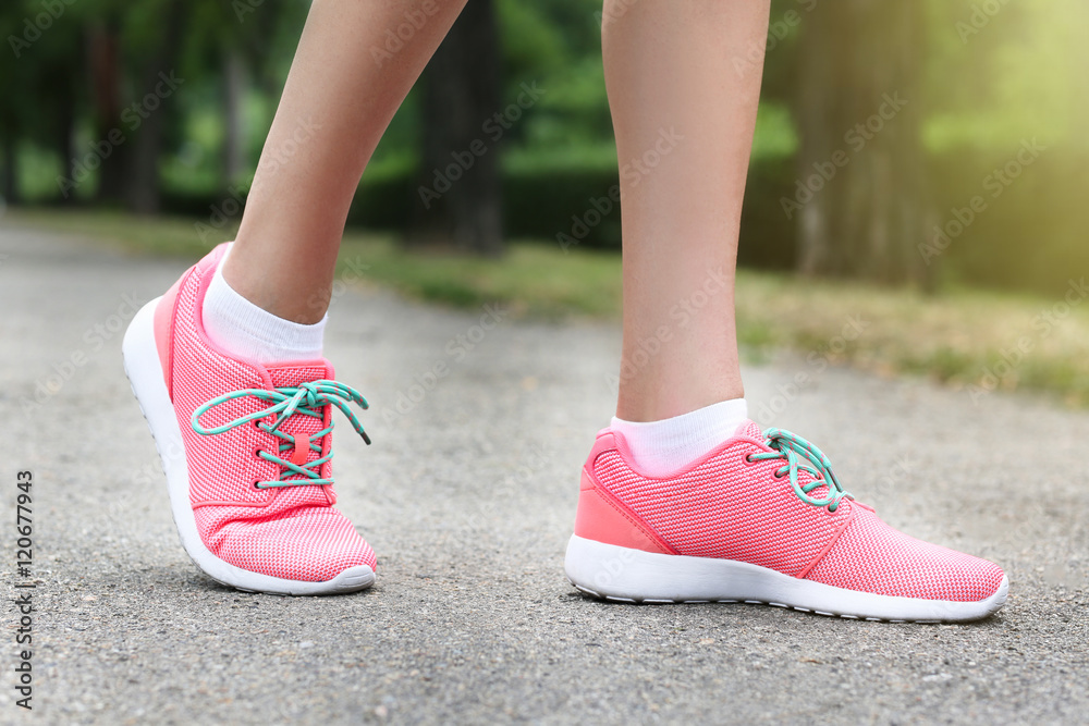 Woman wearing pink sneakers