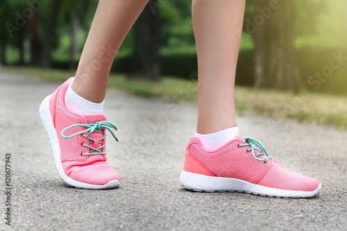 Woman wearing pink sneakers