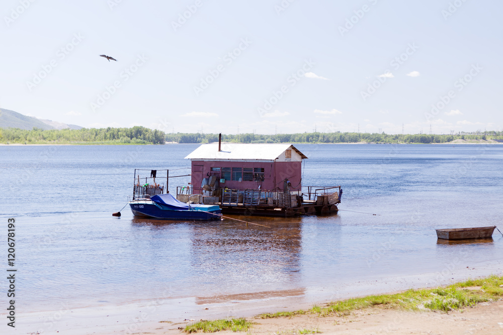 houseboat on water of river in summer