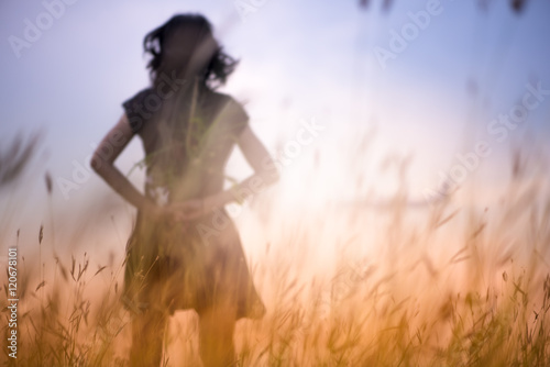 Blur photo of emotions moment of girl with flowers waiting for first summer.