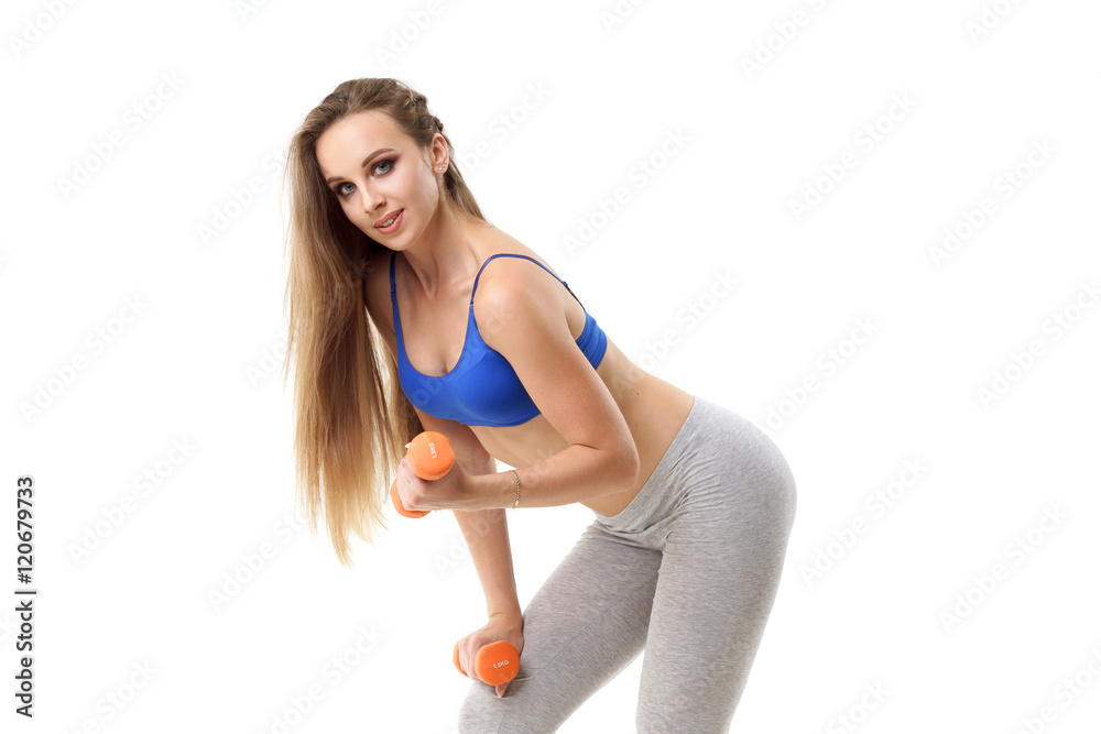 Concepts: healthy lifestyle, sport. Happy beautiful woman fitness trainer working out with small dumbbells isolated on white background Concepts: healthy lifestyle, sport. Happy beautiful woman fitness trainer working out with small dumbbells isolated on white background