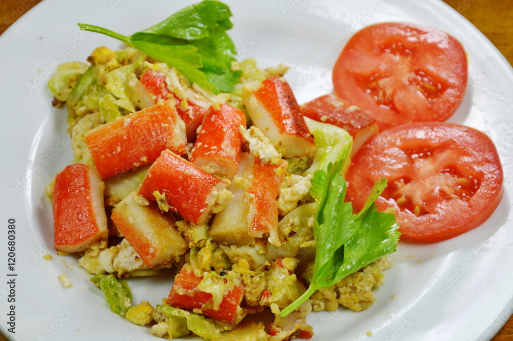 stir fried cabbage with imitation crab and egg on dish stir fried cabbage with imitation crab and egg on dish