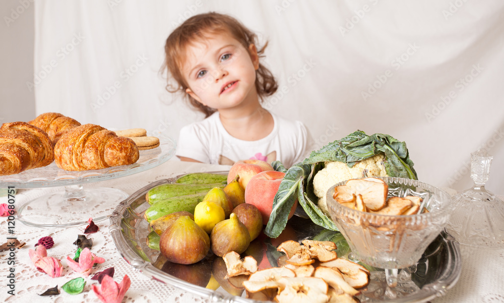 Beautiful girl in the studio with healthy baby food. Beautiful girl in the studio with healthy baby food.