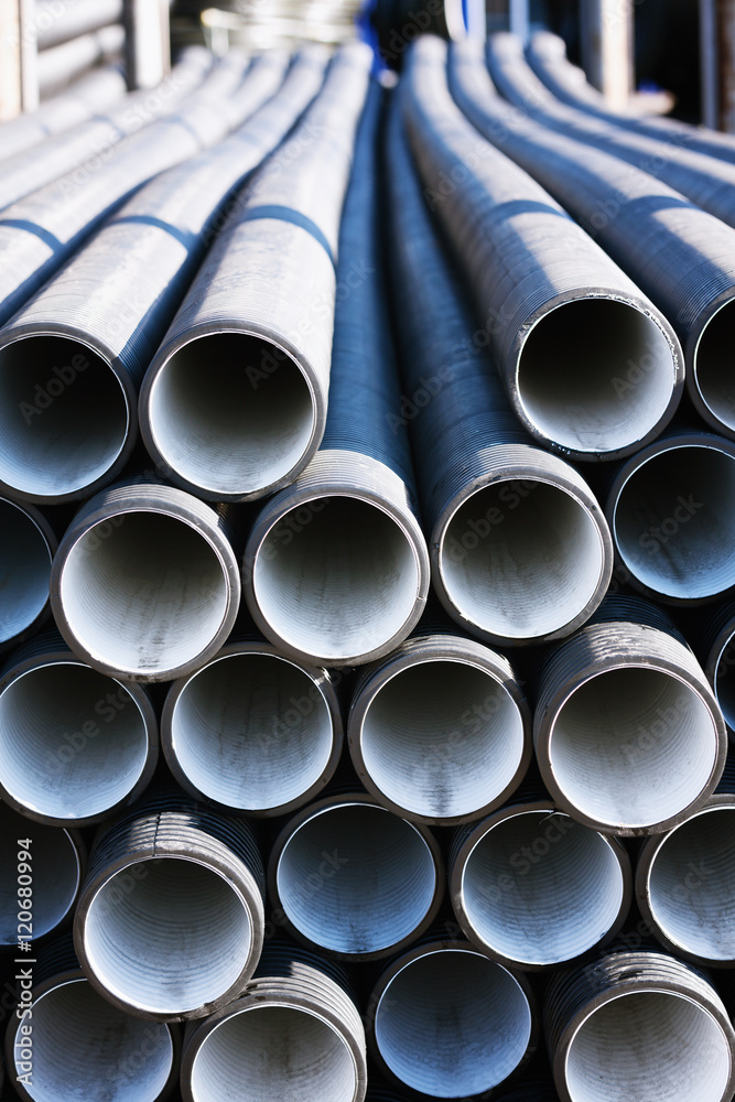 background of colorful grey plastic pipes used at the building site. background of colorful grey plastic pipes used at the building site.