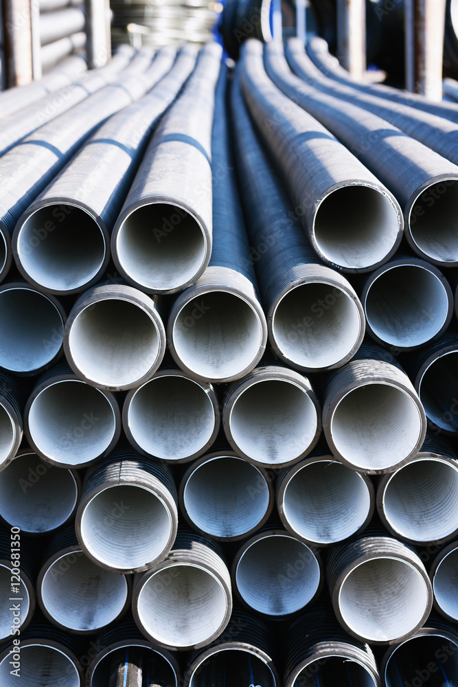background of colorful grey plastic pipes used at the building site. background of colorful grey plastic pipes used at the building site.