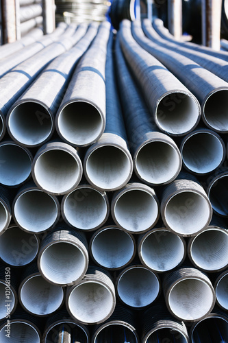 background of colorful grey plastic pipes used at the building site.