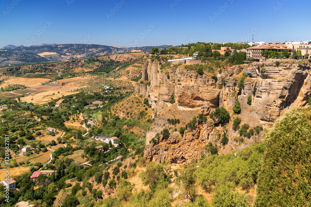 Buildings on the cliffside of El Tajo Gorge in Ronda, Malaga province, Spain.