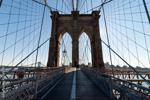 Walk across Brooklyn Bridge backlit © Val Traveller
