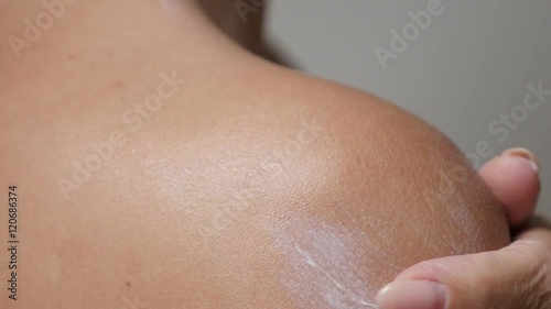 Sensual woman spreading body lotion on tanned skin close-up 4K 2160p 30fps UHD footage - Female hand cream applying after sunbathing 3840X2160 UltraHD video 