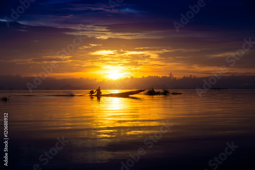 Fototapeta Naklejka Na Ścianę i Meble -  Beautiful sky and Silhouettes of boat at the lake, Thailand.