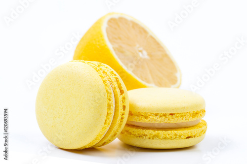 Fototapeta Naklejka Na Ścianę i Meble -  Yellow macaroons with lemon on white background