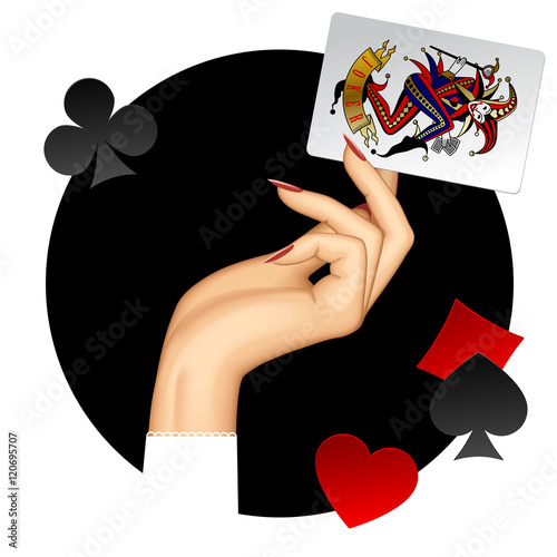 Hand of woman holding Joker playing card on the black round