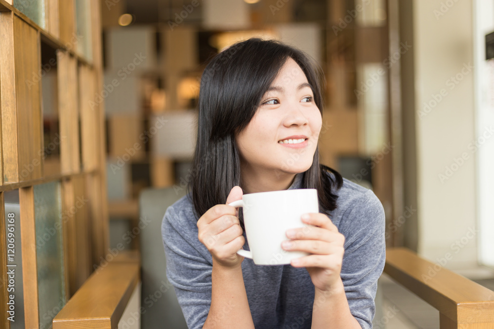 Woman drinking coffee in the morning at cafe Woman drinking coffee in the morning at cafe