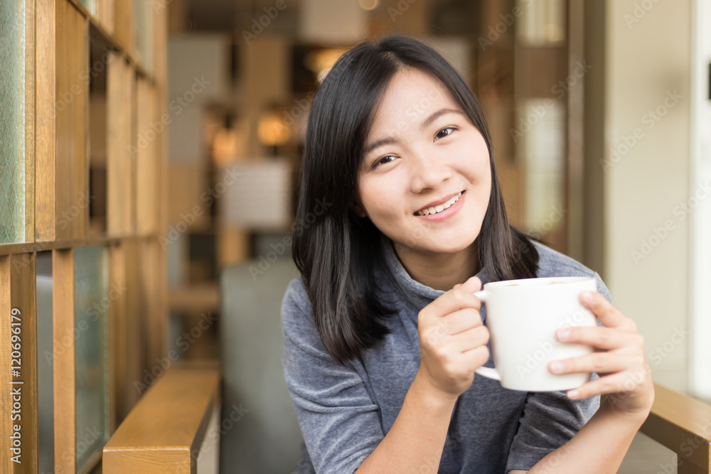 Woman drinking coffee in the morning at cafe Woman drinking coffee in the morning at cafe