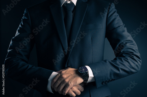 Businessman in Black Suit on Isolated Background