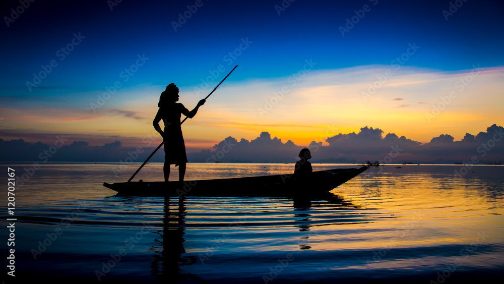Beautiful sky and Silhouettes of fisherman at the lake, Thailand