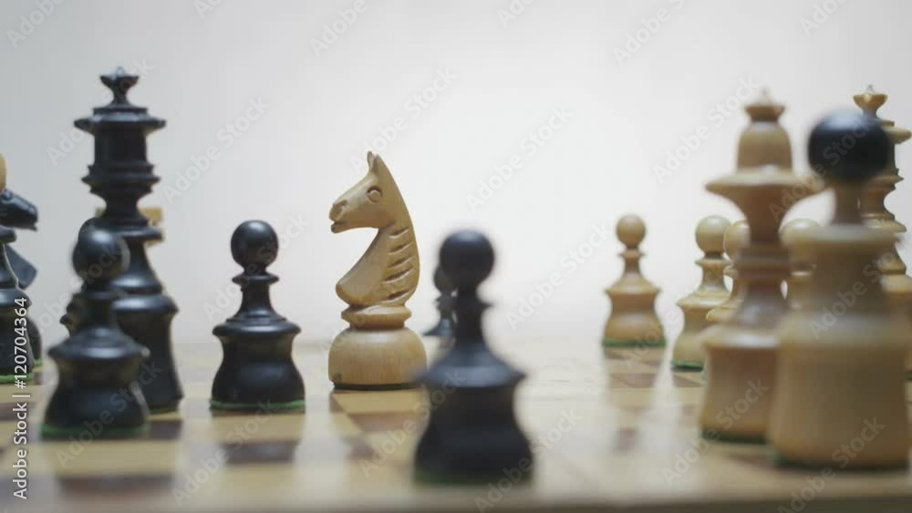 Playing chess. White horse beats black runner. Chess board rotation. Black pawn beats white horse. White background.
Playing chess. White horse beats black runner. Chess board rotation. Black pawn beats white horse. White background.
