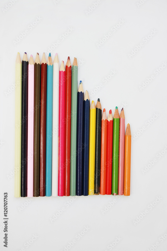Row of old rustic used color wooden pencils isolated on white background designer art work place tools Row of old rustic used color wooden pencils isolated on white background designer art work place tools