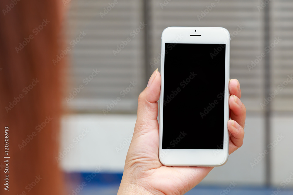 Close up Young girl using smartphone, Hand holding phone on black screen for technology background Close up Young girl using smartphone, Hand holding phone on black screen for technology background