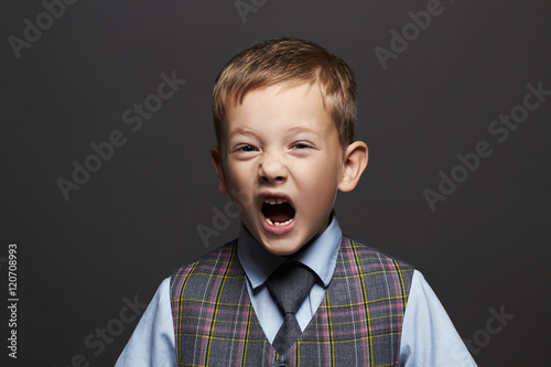kids emotion.fashionable little boy.stylish funny child in suit and tie.children