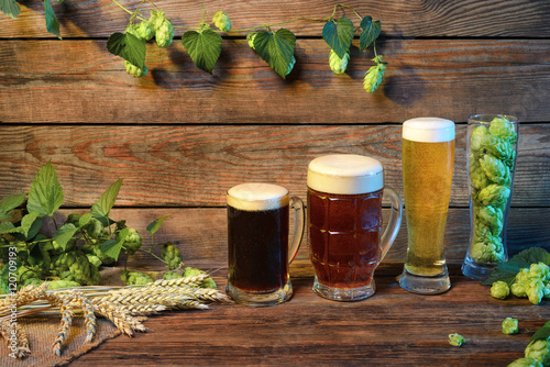 beer assortment on wooden table in bar or pub decorated background