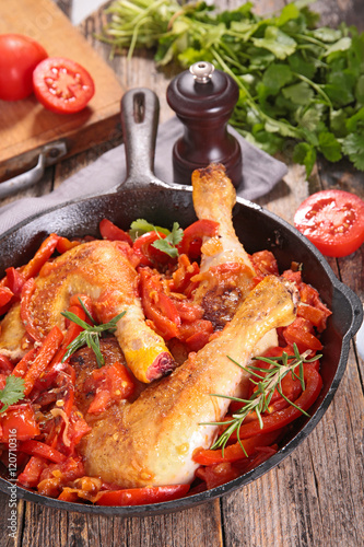 chicken leg cooked with tomato and herbs