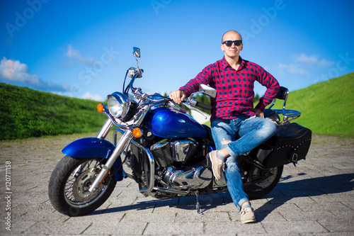 young handsome man with retro motorcycle