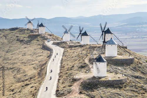 Bikers on th famous windmills in Consuegr, province of Toledo, Castile-La Mancha, Spain photo