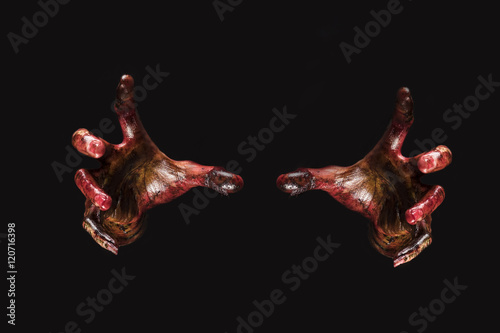 Blood zombie hands on back background,zombie theme, halloween th