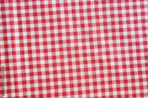 Red picnic tablecloth background, checkered fabric.