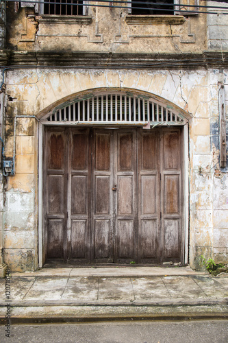 old wood door of classic building © kunchainub