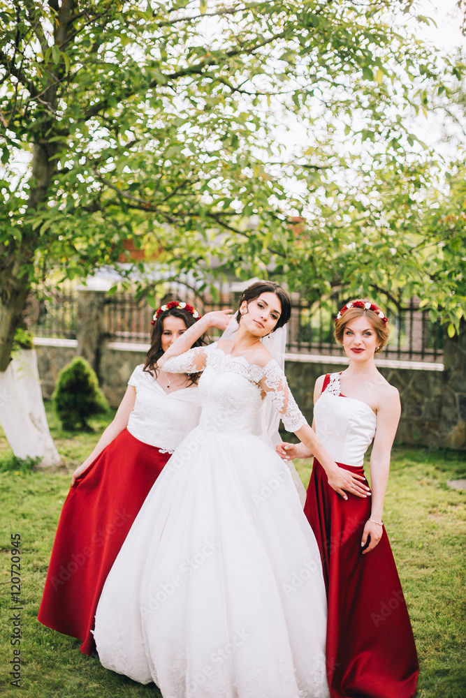 Bride with bridesmaids. Friends in the same dress