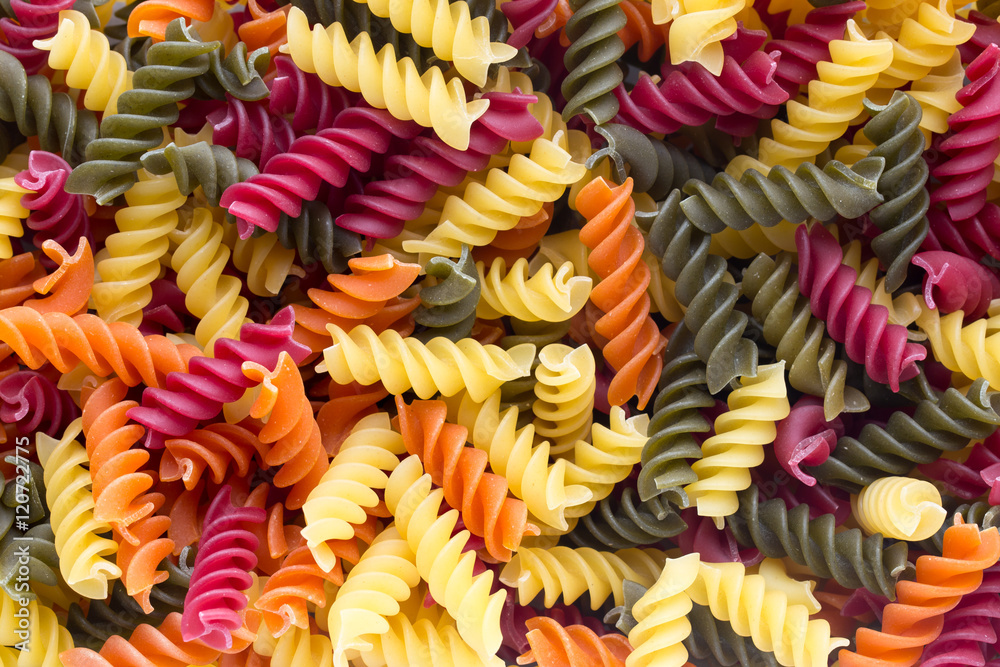 Closeup of raw eco macaroni pasta background.