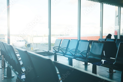 Empty airport interior. Empty seating at boarding gate at an airport. departure lounge