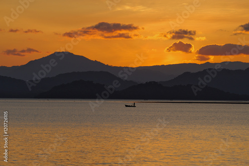 Lonely fisherman in the Nicoya Gulf after sunset