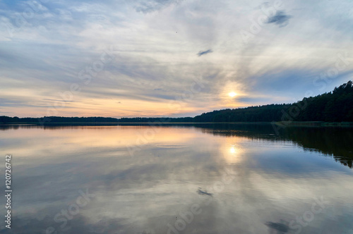Beautiful panoramic view of the sunset over Lemiet lake in Mazury district  Poland. Fantastic travel destination.